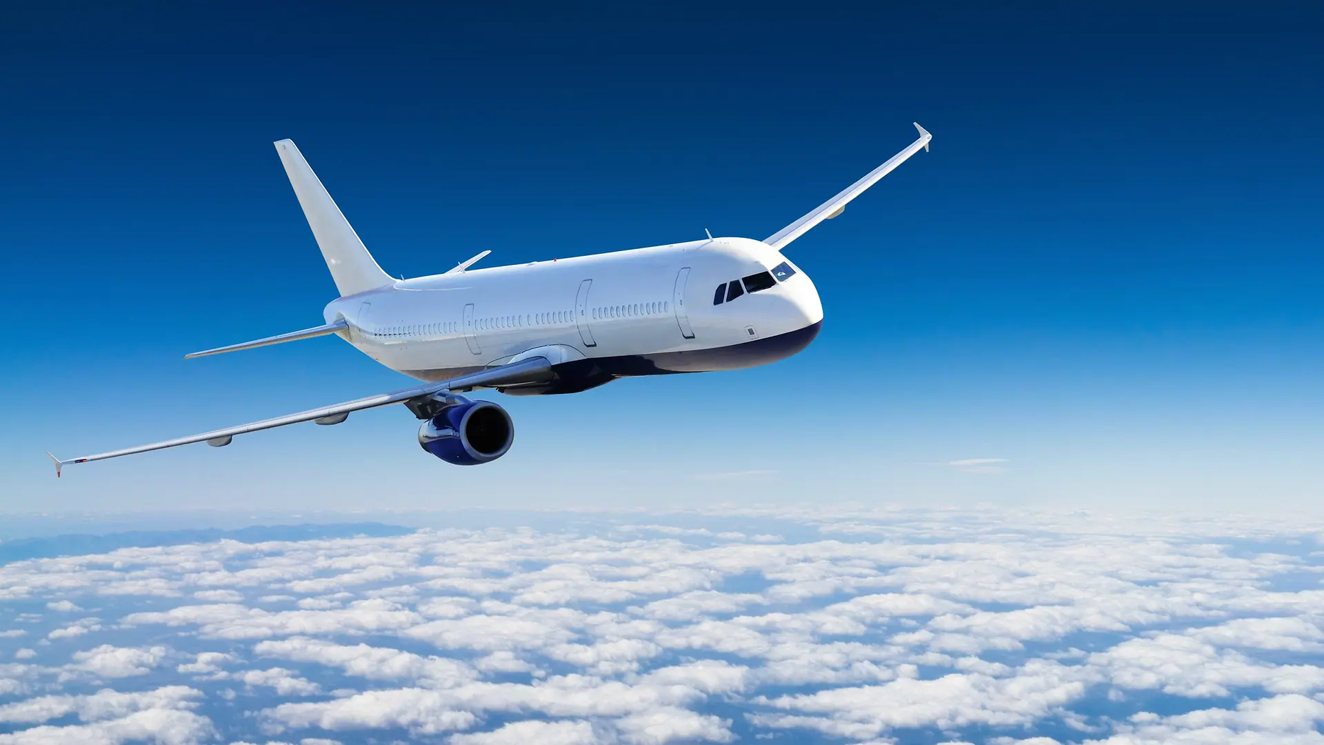 Passenger aircraft flying above the clouds